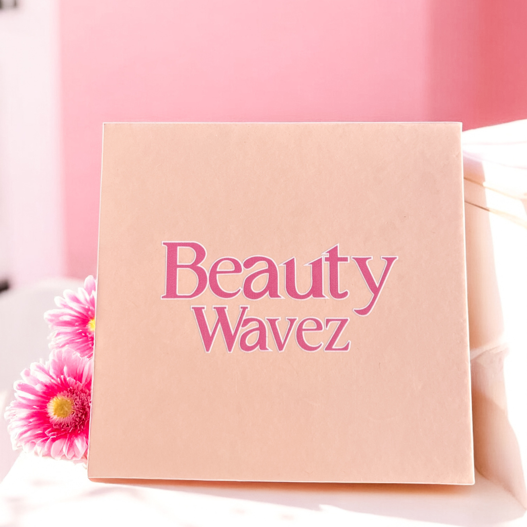 Beauty Wavez matte liquid lipstick set in peach packaging with six vibrant shades, displayed against a soft pink background.