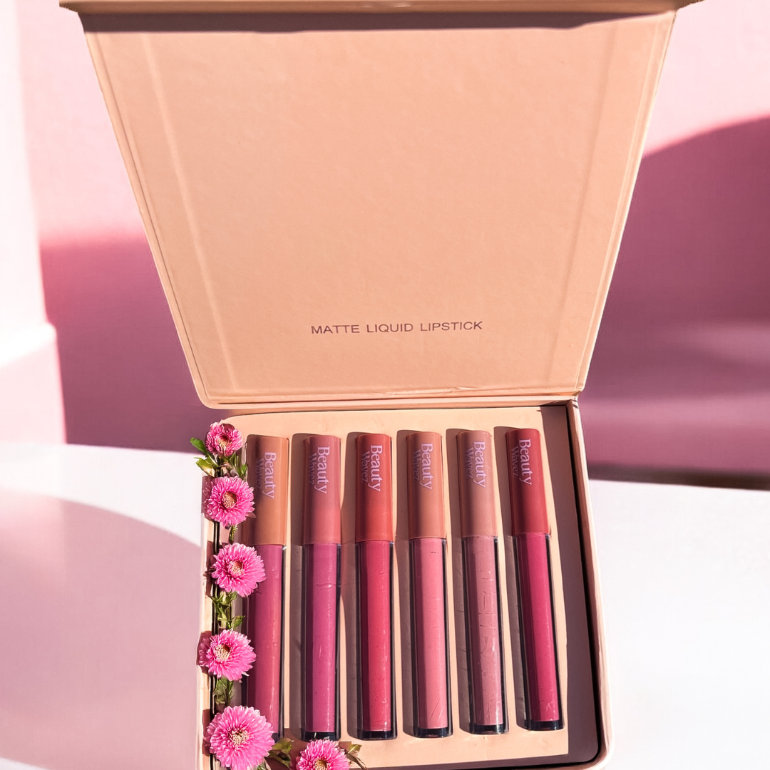 Beauty Wavez matte liquid lipstick set in peach packaging with six vibrant shades, displayed against a soft pink background.